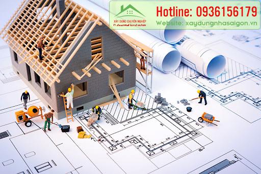 building house on blueprints with worker – construction project – HM Việt Nam – Design &amp; Build